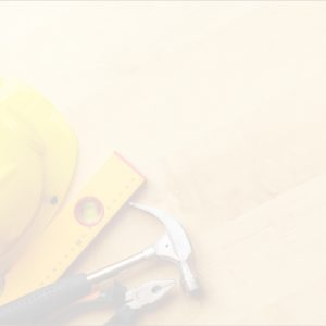 Construction hat, level, hammer and pliers on a workbench with a white overlay